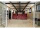 Home theater with tiered seating and projector screen viewed through decorative glass doors at 4115 Falls Ridge Dr, Johns Creek, GA 30022