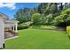 Large backyard with lush green grass and landscaping at 4206 Moccasin Trl, Woodstock, GA 30189