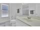 Bright bathroom with a large mirror, and modern fixtures at 4206 Moccasin Trl, Woodstock, GA 30189