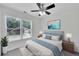 Light and airy bedroom featuring a ceiling fan, soft lighting and a comfortable bed at 4206 Moccasin Trl, Woodstock, GA 30189