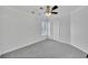 Neutral bedroom with a ceiling fan, closet, and soft carpeting at 4206 Moccasin Trl, Woodstock, GA 30189