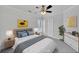 Cozy bedroom featuring a ceiling fan, soft lighting and a comfortable bed at 4206 Moccasin Trl, Woodstock, GA 30189
