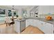 Bright kitchen featuring stainless appliances, white cabinets, granite countertops, and eat-in table at 4206 Moccasin Trl, Woodstock, GA 30189