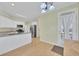 Modern kitchen with white cabinets and stainless steel appliances and adjacent dining area at 4206 Moccasin Trl, Woodstock, GA 30189