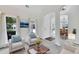 Open-concept living area with an archway, neutral palette, and elegant dining room access at 4206 Moccasin Trl, Woodstock, GA 30189
