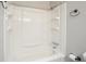 Bathroom featuring a white tub/shower with chrome fixtures and a linen closet at 7025 Stone Wood Nw Dr, Kennesaw, GA 30152