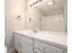 Bathroom featuring white vanity, laminate countertop, and a framed mirror at 7025 Stone Wood Nw Dr, Kennesaw, GA 30152