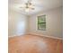 Bedroom with hardwood floors and a window with a view of trees at 7025 Stone Wood Nw Dr, Kennesaw, GA 30152