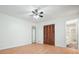 Bedroom with hardwood floors and a closet with an adjoined bathroom at 7025 Stone Wood Nw Dr, Kennesaw, GA 30152
