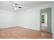 Bedroom with hardwood floors and a mirrored door and a window at 7025 Stone Wood Nw Dr, Kennesaw, GA 30152