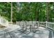Outdoor deck has a dining table with seating for six at 7025 Stone Wood Nw Dr, Kennesaw, GA 30152