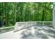 Expansive deck overlooks a lush backyard and wooded area at 7025 Stone Wood Nw Dr, Kennesaw, GA 30152