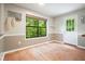 Cozy kitchen area featuring hardwood floors, a garden view window, and an open layout at 7025 Stone Wood Nw Dr, Kennesaw, GA 30152
