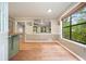 Cozy kitchen area featuring hardwood floors, a garden view window, and an open layout at 7025 Stone Wood Nw Dr, Kennesaw, GA 30152