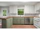 A kitchen featuring stainless steel appliances, white cabinets, tile backsplash and wooden countertops at 7025 Stone Wood Nw Dr, Kennesaw, GA 30152