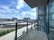 Enjoy the views from this balcony, featuring sleek glass railings, and expansive city views at 788 W Marietta Nw St # 512, Atlanta, GA 30318