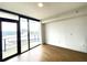 Modern condo with floor to ceiling windows overlooking a city view and hardwood flooring at 788 W Marietta Nw St # 512, Atlanta, GA 30318