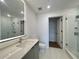 Modern bathroom featuring a dual shower head, backlit mirror, and sleek vanity at 788 W Marietta Nw St # 512, Atlanta, GA 30318