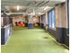 Community dog run area with artificial turf, colorful cityscape mural, and ample sunlight from large windows at 788 W Marietta Nw St # 512, Atlanta, GA 30318