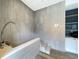 Well-lit dog wash area with stainless steel fixtures and tiled walls for easy cleaning in modern designed community at 788 W Marietta Nw St # 512, Atlanta, GA 30318