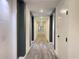 Modern hallway with neutral paint, wood flooring, and recessed lighting at 788 W Marietta Nw St # 512, Atlanta, GA 30318