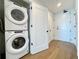 Laundry area with modern stacked washer and dryer units in a condo at 788 W Marietta Nw St # 512, Atlanta, GA 30318