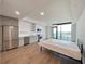 Open-concept living area with kitchen and expansive windows and hard wood flooring at 788 W Marietta Nw St # 512, Atlanta, GA 30318