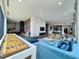 Large lounge featuring a shuffleboard table, comfortable couches, and a fireplace at 788 W Marietta Nw St # 512, Atlanta, GA 30318