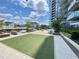 Rooftop deck with a turfed recreation area, dining, and lounge seating at 788 W Marietta Nw St # 512, Atlanta, GA 30318