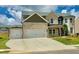 Beautiful two-story brick home with a spacious driveway and well-maintained lawn at 118 Longhorn Way, Auburn, GA 30011