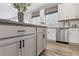 Updated kitchen featuring modern appliances, granite countertops, and classic white cabinetry at 118 Longhorn Way, Auburn, GA 30011
