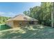 Well maintained backyard with lush greenery surrounding this beautiful brick home, a perfect setting for relaxation at 150 Whitworth Dr, Locust Grove, GA 30248