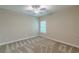 Bright bedroom with neutral walls, carpet, and natural light from the window at 150 Whitworth Dr, Locust Grove, GA 30248