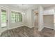 Bright dining area with hardwood floors, modern lighting, and sliding doors to the outside at 150 Whitworth Dr, Locust Grove, GA 30248