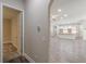 Hallway view into a modern kitchen with white cabinets and an island at 150 Whitworth Dr, Locust Grove, GA 30248