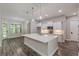 Bright kitchen with modern cabinets, a large center island and stainless steel appliances at 150 Whitworth Dr, Locust Grove, GA 30248