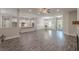 Open-concept living area with fireplace, modern flooring, and direct kitchen access at 150 Whitworth Dr, Locust Grove, GA 30248