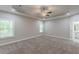 Large main bedroom with tray ceilings, recessed lighting and ensuite bathroom access at 150 Whitworth Dr, Locust Grove, GA 30248
