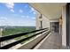 Long tiled balcony with black railings overlooking a scenic city and forest at 2660 Peachtree Nw Rd # 23A, Atlanta, GA 30305