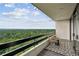 Spacious balcony offering serene nature views and comfortable seating, perfect for enjoying the outdoors at 2660 Peachtree Nw Rd # 23A, Atlanta, GA 30305