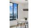 Bright dining area with seating for three overlooking a city skyline at 2660 Peachtree Nw Rd # 23A, Atlanta, GA 30305