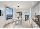 Bright dining area with elegant chandelier, granite counters and a stunning city view at 2660 Peachtree Nw Rd # 23A, Atlanta, GA 30305