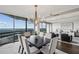 Bright formal dining room with skyline views open to the living room at 2660 Peachtree Nw Rd # 23A, Atlanta, GA 30305