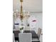 Close up of formal dining room with modern chandelier at 2660 Peachtree Nw Rd # 23A, Atlanta, GA 30305