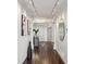 Bright hallway with zebra rug, mirrored wall, modern lighting, and leading to other areas of the home at 2660 Peachtree Nw Rd # 23A, Atlanta, GA 30305