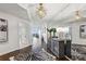 Hallway with a mirrored wall, decorative lighting, zebra rug, hardwood floors and a glimpse of a bright living area at 2660 Peachtree Nw Rd # 23A, Atlanta, GA 30305