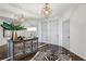 Hallway featuring a mirrored wall, decorative lighting, a unique zebra print rug, and a stylish console table at 2660 Peachtree Nw Rd # 23A, Atlanta, GA 30305