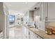 Stylish kitchen with city view, granite counters, subway tile backsplash, and modern fixtures create a culinary haven at 2660 Peachtree Nw Rd # 23A, Atlanta, GA 30305