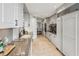 Bright, updated kitchen with granite countertops, stainless appliances, and abundant cabinet space for ample storage at 2660 Peachtree Nw Rd # 23A, Atlanta, GA 30305