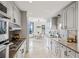 Well-lit kitchen with stainless steel appliances, granite countertops, and sleek white cabinets for a modern feel at 2660 Peachtree Nw Rd # 23A, Atlanta, GA 30305